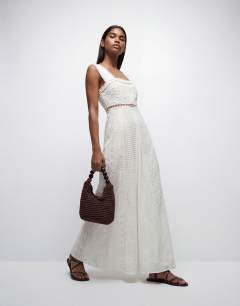 Model wearing Cutwork broderie mixed trapeze maxi dress in white