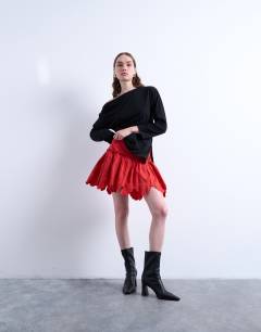 Model wearing Cutwork scalloped edge mini skirt in red