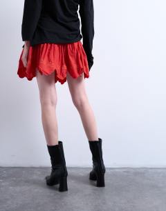 Model wearing Cutwork scalloped edge mini skirt in red