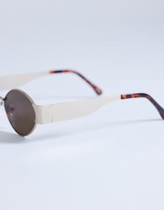 Model wearing Cyprus metal frame sunglasses in gold