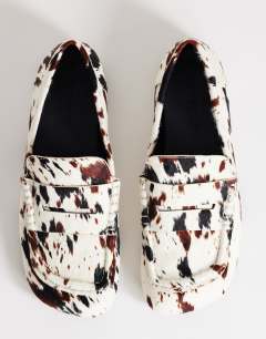 Model wearing Daniel flat square toe loafer in animal print hair on real leather