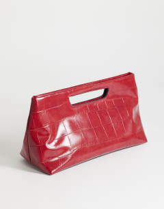 Model wearing Daniel medium rectangle grab bag in red croc