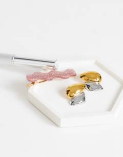Model wearing Danny waterproof stainless steel statement earrings in gold and silver