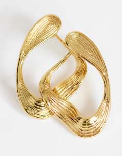 Model wearing Daphne waterproof stainless steel earrings in gold