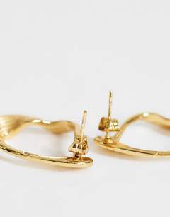 Model wearing Daphne waterproof stainless steel earrings in gold