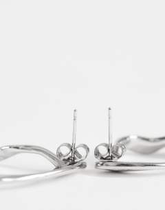 Model wearing Daphne waterproof stainless steel earrings in silver