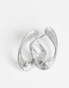 Model wearing Daphne waterproof stainless steel earrings in silver