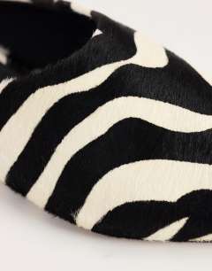 Model wearing Dawn flat pointed shoe in zebra print hair on real leather