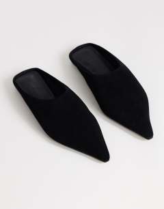 Model wearing Dawn real suede flat pointed shoe in black