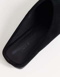 Model wearing Dawn real suede flat pointed shoe in black