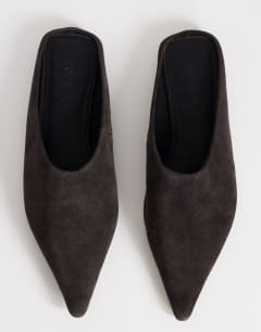 Model wearing Dawn real suede flat pointed shoe in chocolate