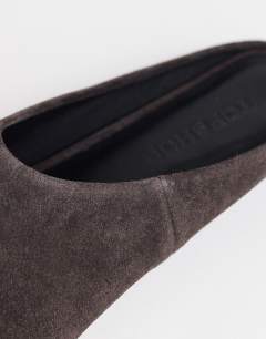 Model wearing Dawn real suede flat pointed shoe in chocolate