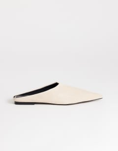 Model wearing Dawn real suede flat pointed shoe in sand