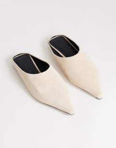 Model wearing Dawn real suede flat pointed shoe in sand