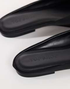 Model wearing Dawson slip on mule in black satin