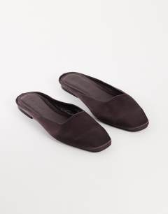 Model wearing Dawson slip on mule in chocolate satin