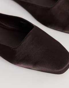 Model wearing Dawson slip on mule in chocolate satin