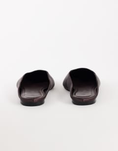 Model wearing Dawson slip on mule in chocolate satin