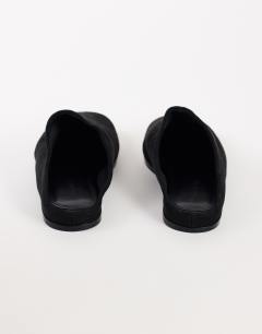Model wearing Debbie faux suede square toe flat shoe mule in black