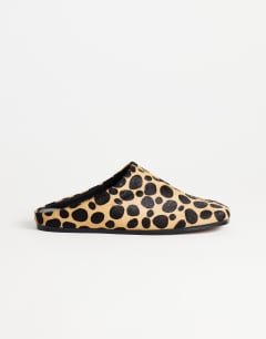 Model wearing Debbie square toe flat shoe mule in leopard print  hair on real leather