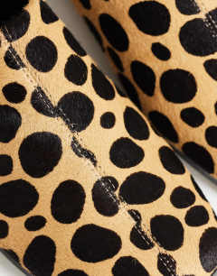 Model wearing Debbie square toe flat shoe mule in leopard print  hair on real leather