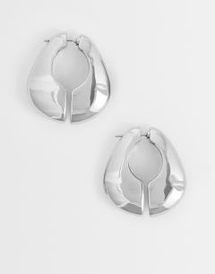 Model wearing Declan hoop earrings in silver