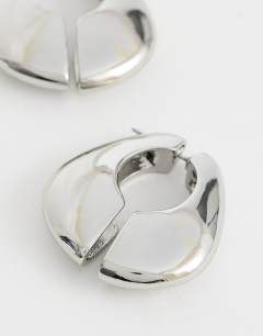 Model wearing Declan hoop earrings in silver