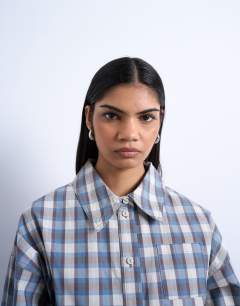 Model wearing Deep cuff shirt in check print