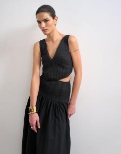 Model wearing Deep v maxi pinny dress with heavy embroidery in black