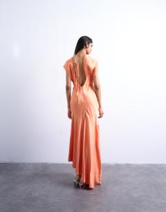 Model wearing Deep v tucked side satin maxi dress in peach