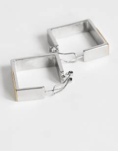 Model wearing Delia waterproof stainless steel square hoop earring in silver with gold