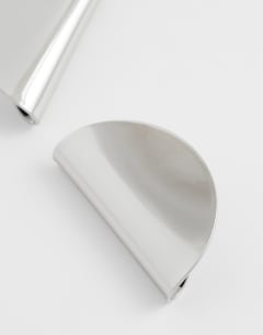 Model wearing Della statement stud earrings in silver
