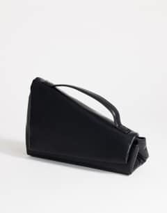 Model wearing Delta medium pyramid top handle grab bag in black