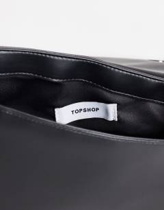 Model wearing Delta medium pyramid top handle grab bag in black