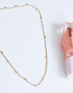 Model wearing Demi chain necklace with diamantes in stainless gold