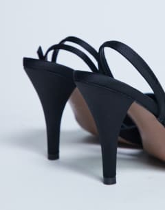 Model wearing Demi cone heel court shoe with tie in black