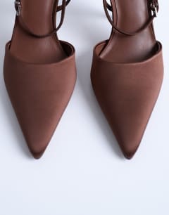 Model wearing Demi cone high heel court shoe with tie in chocolate