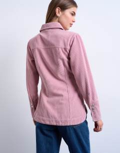 Model wearing Denim 70s collar shirt in pink cord
