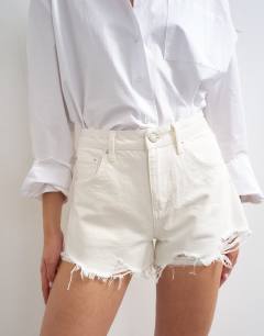 Model wearing Denim A-line short with rip in white