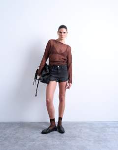 Denim A-line shorts with rip in washed black