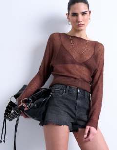 Model wearing Denim A-line shorts with rip in washed black