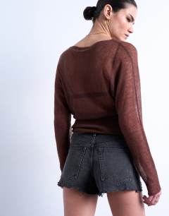 Model wearing Denim A-line shorts with rip in washed black