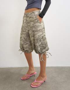 Model wearing Denim baggy camo jorts