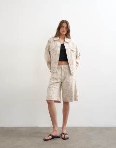 Model wearing Denim balloon jacket in ecru jacquard floral