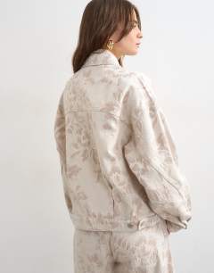 Model wearing Denim balloon jacket in ecru jacquard floral