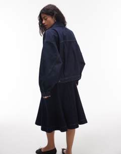 Model wearing Denim balloon jacket in indigo rinse
