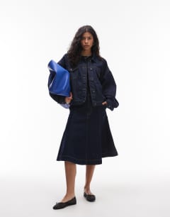 Model wearing Denim balloon jacket in indigo rinse