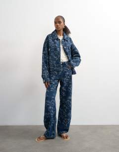 Model wearing Denim balloon jacket in jacquard floral blue