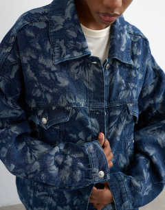 Model wearing Denim balloon jacket in jacquard floral blue