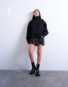 Model wearing Denim balloon sleeve oversized jacket in washed black